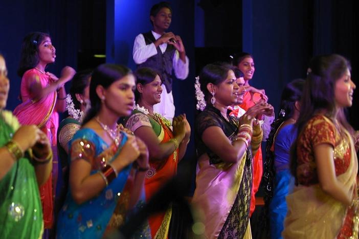 The children and parents of the Banana Children’s Choir perform at their concert.