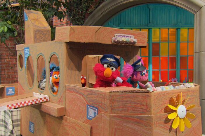 Elmo, Abby, Rudy, and Chris make a pretend airplane.