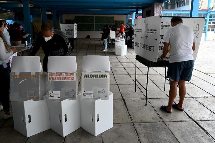 Millions of Mexicans vote in a violence-marred midterm election