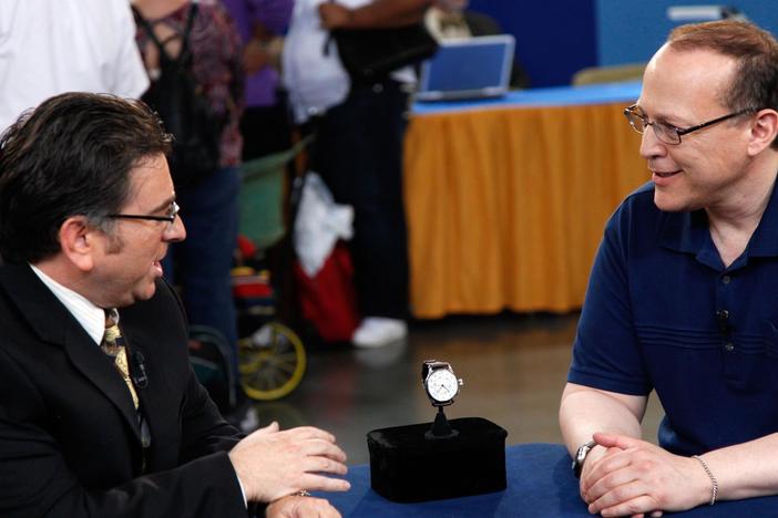 Craig Evans Small looks at a Longine aviator's watch designed by Charles Lindbergh.