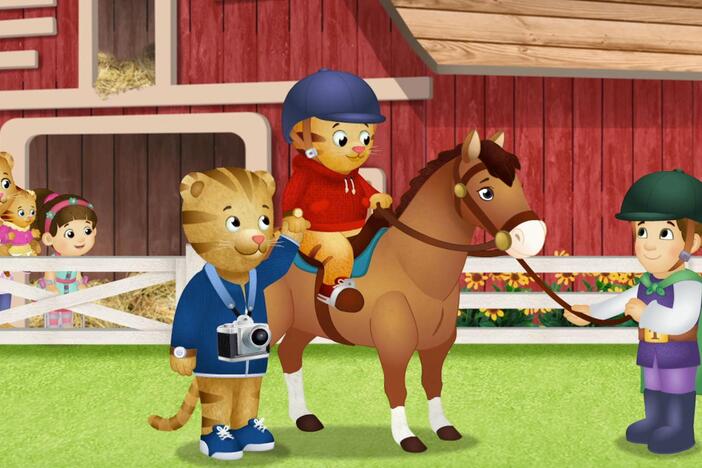 It's Daniel's first time riding a horse. Holding Dad's hand helps him not feel so afraid. 