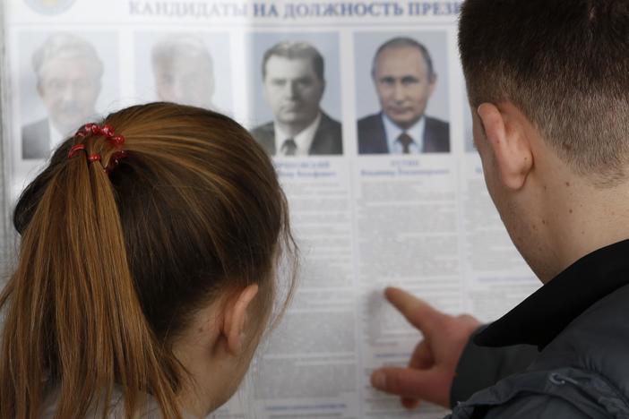 Putin re-elected amid carnival-like atmosphere