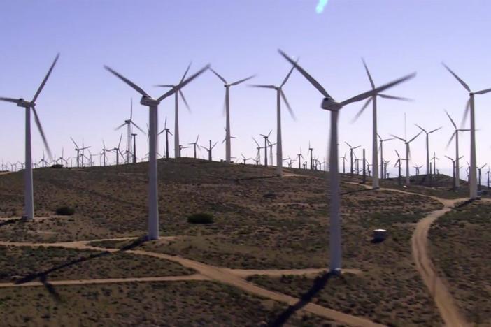 Modern wind turbines capture energy from the wind and convert it into electricity.