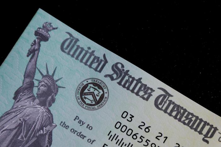 How did the stimulus checks impact everyday Americans?