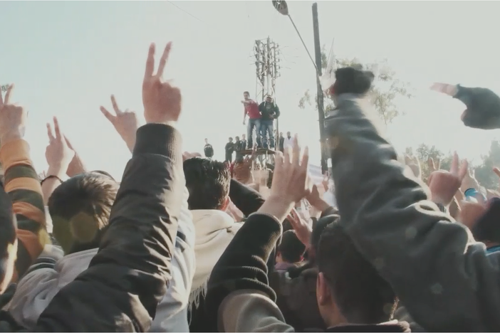 This clip introduces Abdul Basset Saroot and shows footage of a protest.
