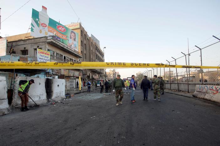 Two suicide bombers targeted a town square in Baghdad, killing at least 38 bystanders.