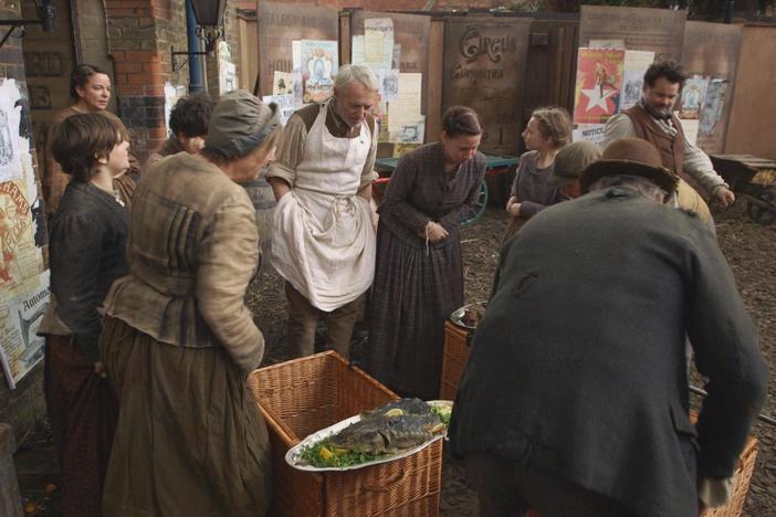 Edward VII's coronation banquet finds its way into the slum.