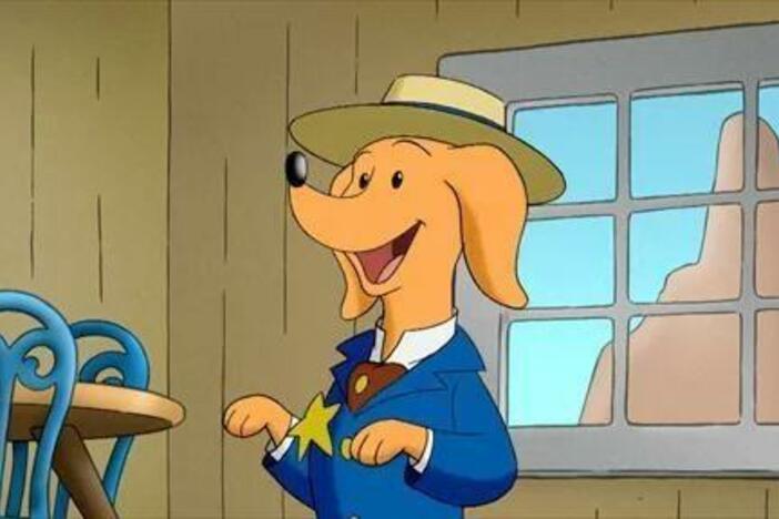 The Man with the Yellow Hat sings a ballad to Hundley about trains.