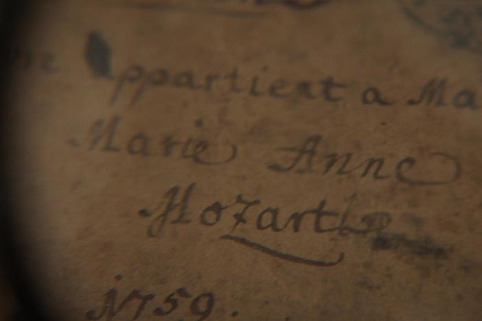 Is there evidence Maria Anna Mozart composed music recorded in her childhood notebook?