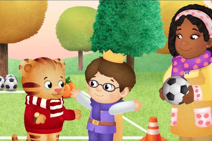 Prince Wednesday has trouble kicking the soccer ball through the goal like his friends.  