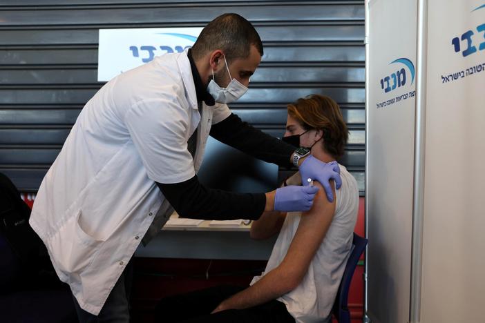 Israel pushes forward with successful vaccine program, but Palestinians feel left behind