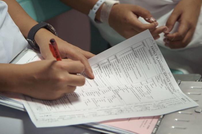 A nurse tries to convince a resistant teen mother to get an IUD.