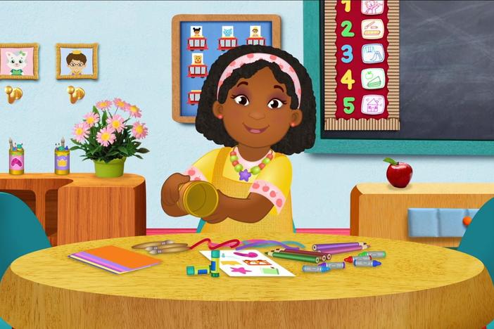 Teacher Harriet makes craft containers for her students.