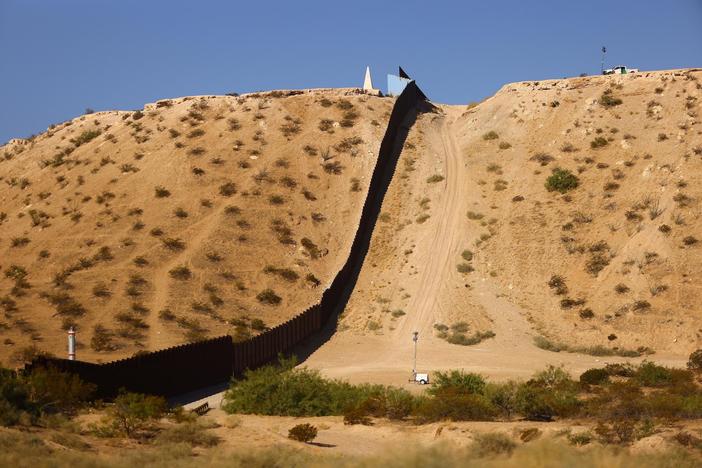 News Wrap: Biden administration clears way for new border wall construction in Texas