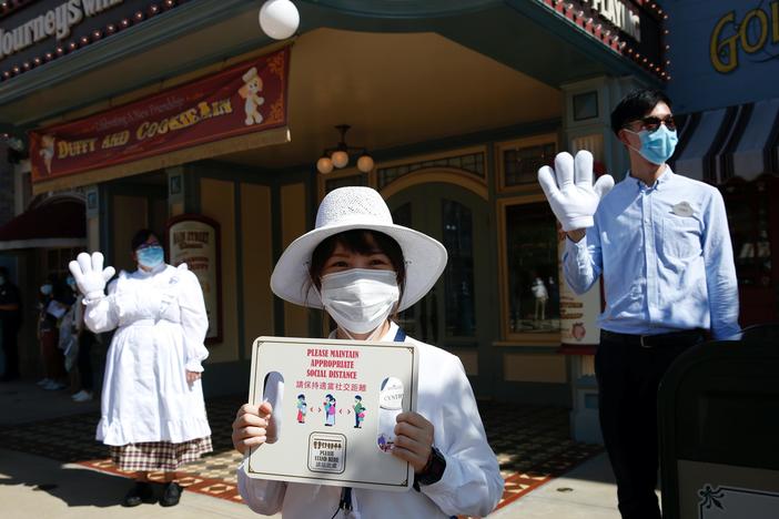 Hong Kong residents challenge government over laws, but fight virus together