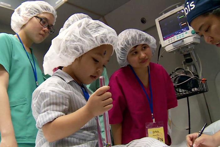 Doctors travel by plane to developing nations to perform eye surgery and to teach others.