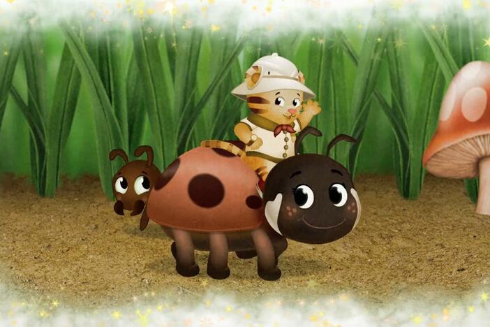 Daniel makes believe he is so little he can ride a ladybug through the grass. 