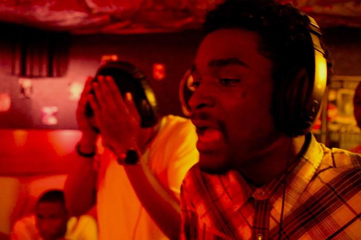 Chris explains that he offers this free studio time to give young men something to do.