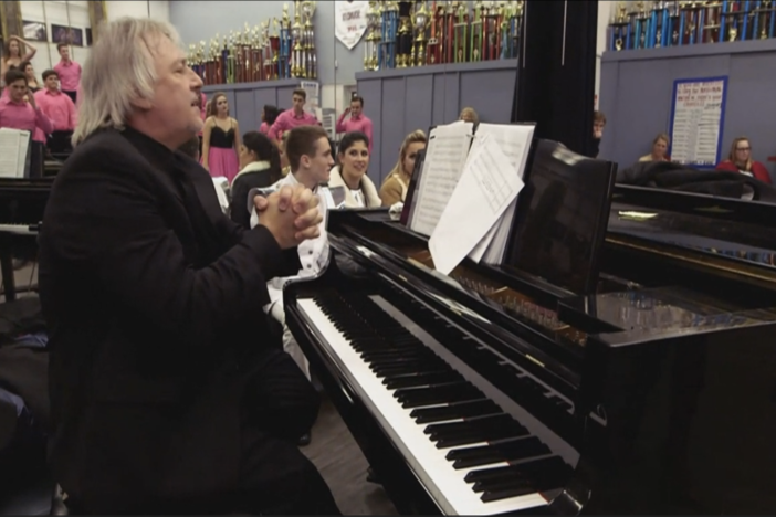 Watch this high school show choir director expel any nerves and doubt with his choir.