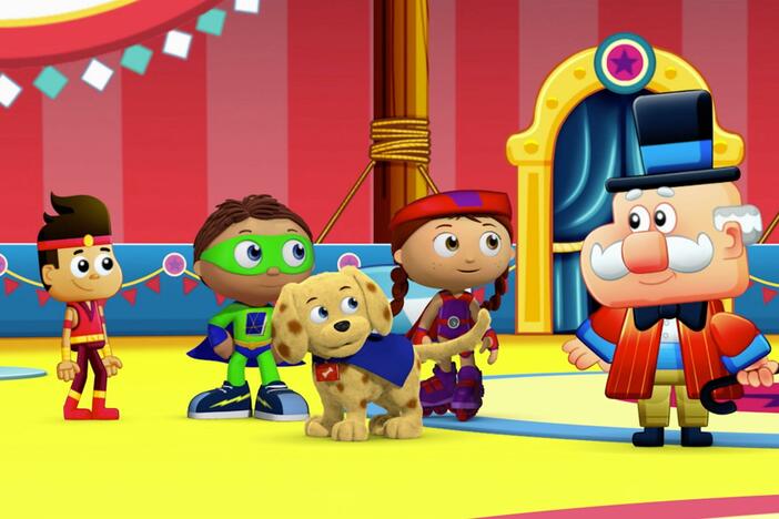 Super Why uses his reading power to help Landon swing on the trapeze.