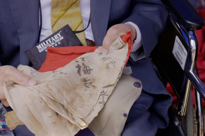 A Japanese soldier’s flag collected by a Marine on the battlefield is returned.