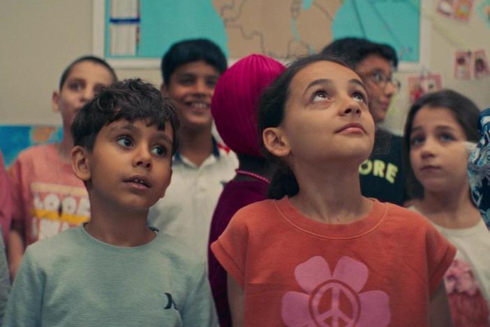 Dulé Hill meets refugee children with Bassel Almadani at the Syrian Community Network.