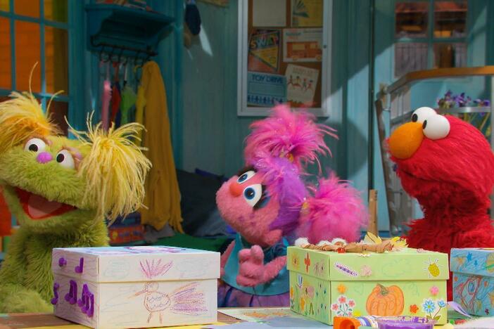 Elmo, Abby, and Karli create treasure boxes that remind them of home.