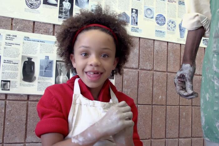 Olivia learns how to make pottery. 