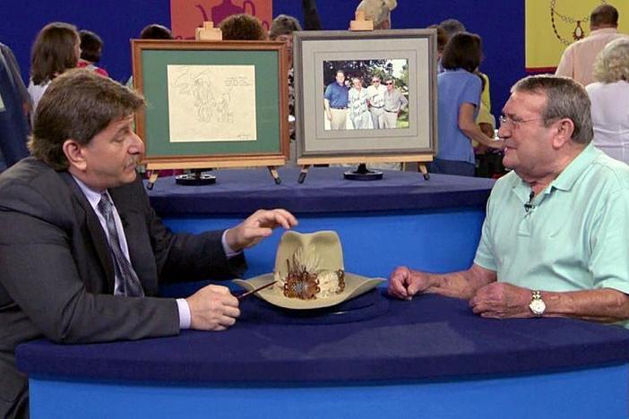 Collectibles expert Philip Weiss appraises a hat fit for a duke - "The Duke" that is.