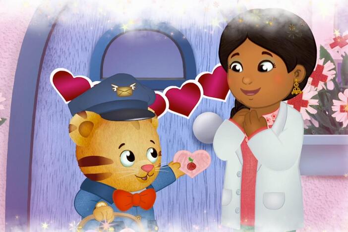 Daniel imagines that he is giving out Love Day cards to all his neighbors.