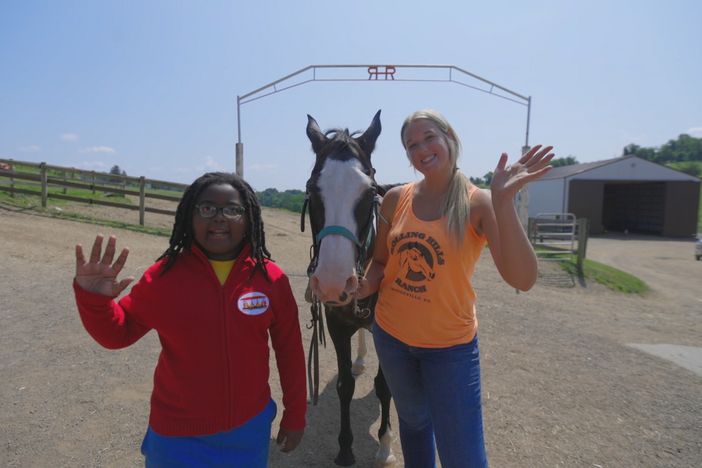 Khian learns how to take care of horses on a ranch.