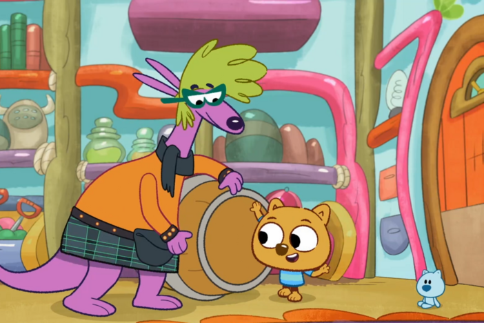 Leiko teaches the Wombats a pattern to play using the taiko drum.