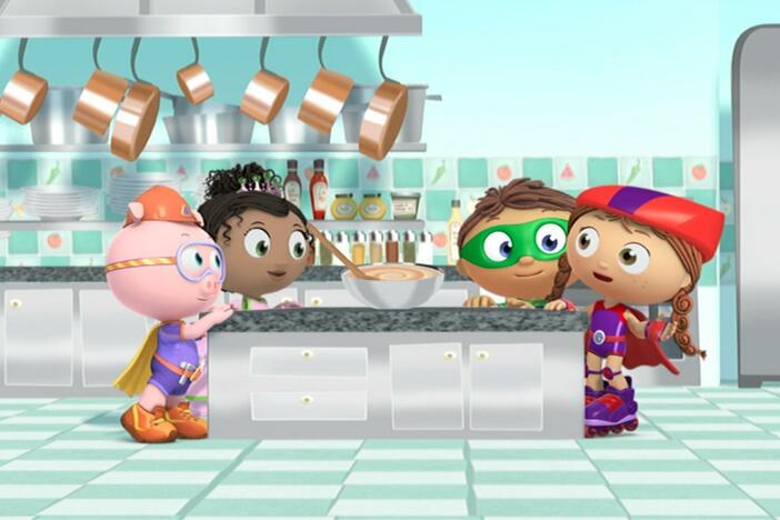 The Super Readers fly into a cookbook to get the ingredients they need for a special cake.