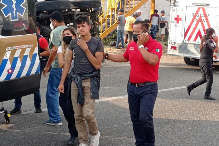 News Wrap: At least 54 dead in migrant truck crash in Mexico