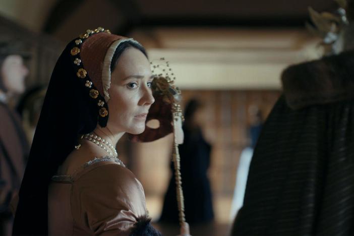 Anne Boleyn is overheard flirting with a courtier at a masked ball.