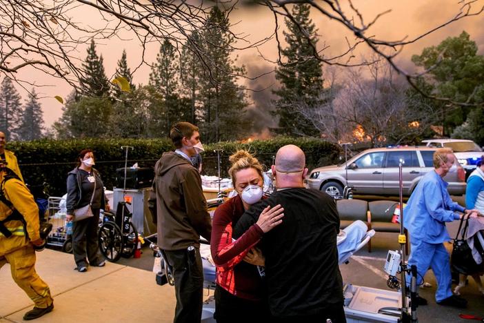 As the Camp Fire scorches a community in California, residents leave by car and on foot.