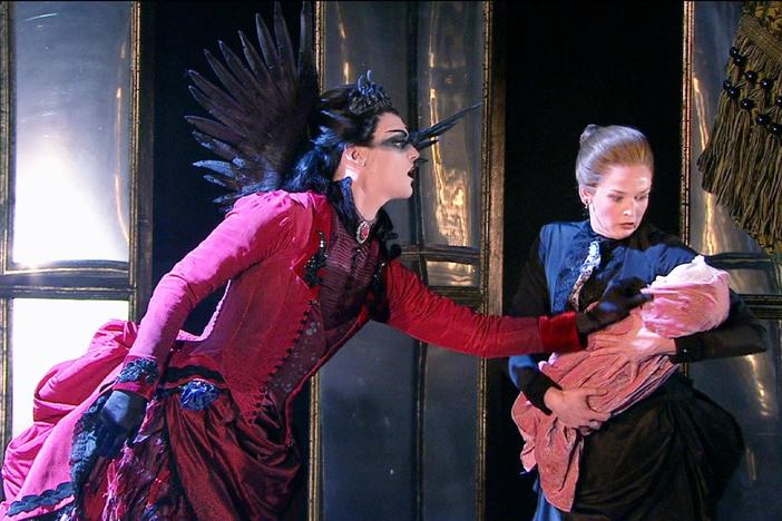 The dark fairy Carabosse casts a curse on baby Aurora.