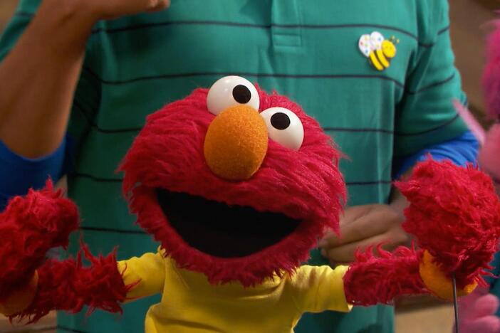 Cookie Monster learns that exercising and moving your body gives you lots of energy.