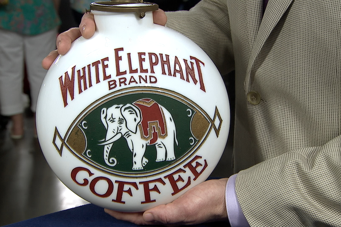 Appraisal: White Elephant Coffee & Tea Advertising Glass Globe, in Somethings Wild.