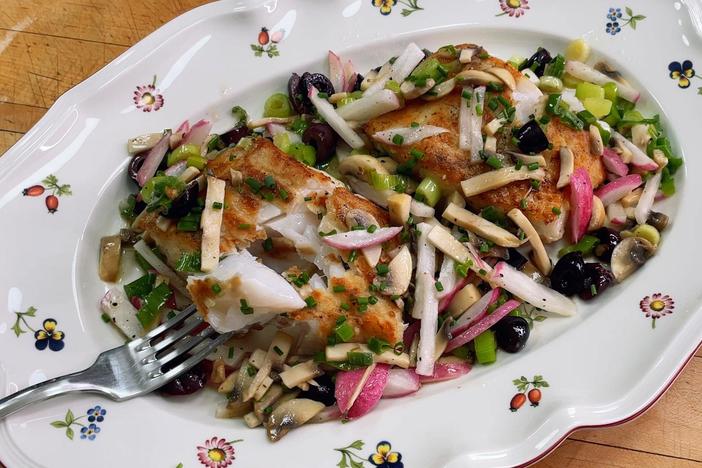 Pépin serves cod with a garnish of vegetables including mushrooms, radishes and olives.