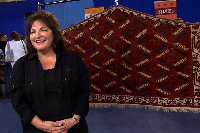 The owner of the "Animal Tree" rug reacts to her surprising ROADSHOW appraisal.