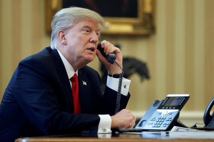 Trump downplays Cohen relationship, hints at DOJ action