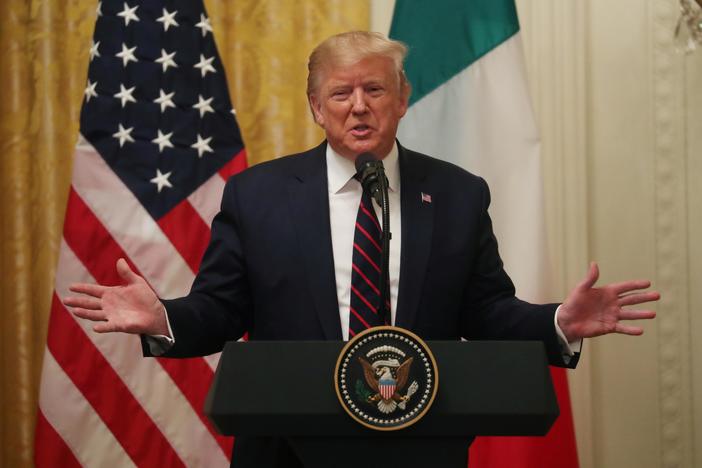 Syria and impeachment put Trump on defensive as House condemns pullout