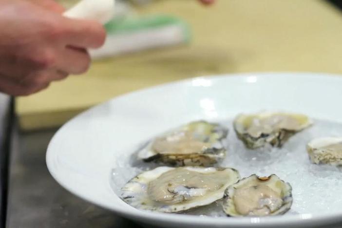 Vivian demonstrates the proper way to shuck and serve oysters on the half-shell.