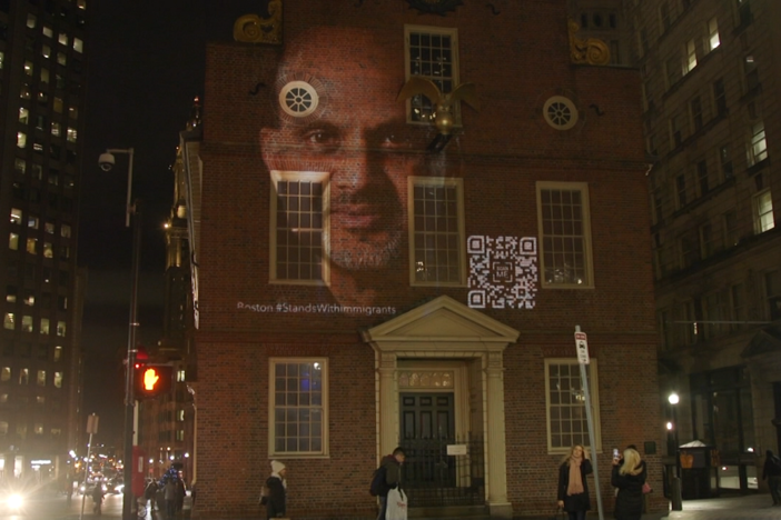 Landscape-sized portraits of immigrants light up Boston
