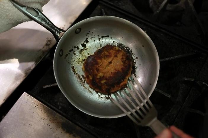 Vivian demonstrates her newest creation: a tasty veggie burger.