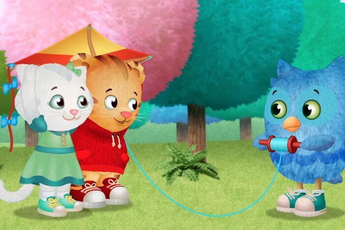 O is happy to play with a kite, but mad that he can't get it to fly.