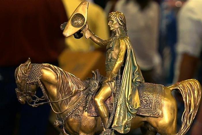 Eric Silver appraises a Jean-Leon Gerome sculpture of "Napoleon Entering Cairo."