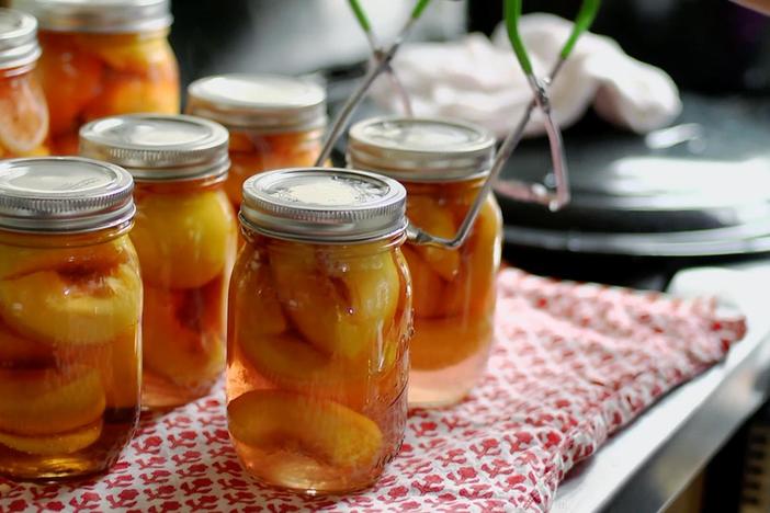 Vivian and Mrs. Scarlett use a family technique to can peaches for use in colder months.