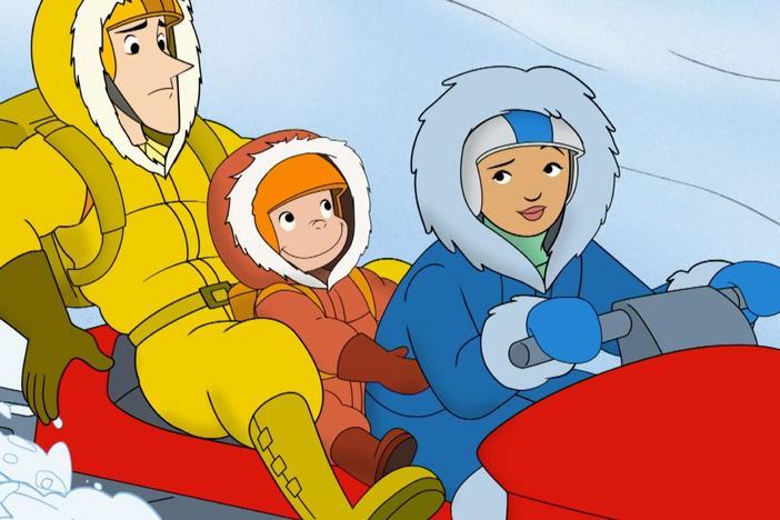 George runs with the sled-dogs. / George meets some giant puppets.